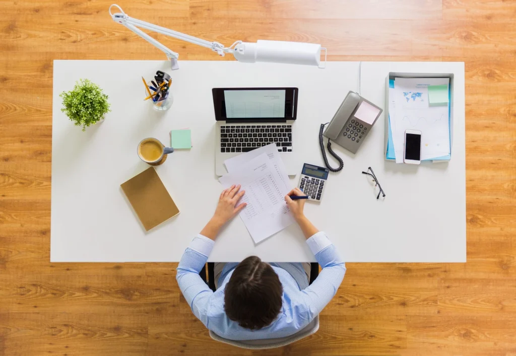 businesswoman analysing tax reports at office